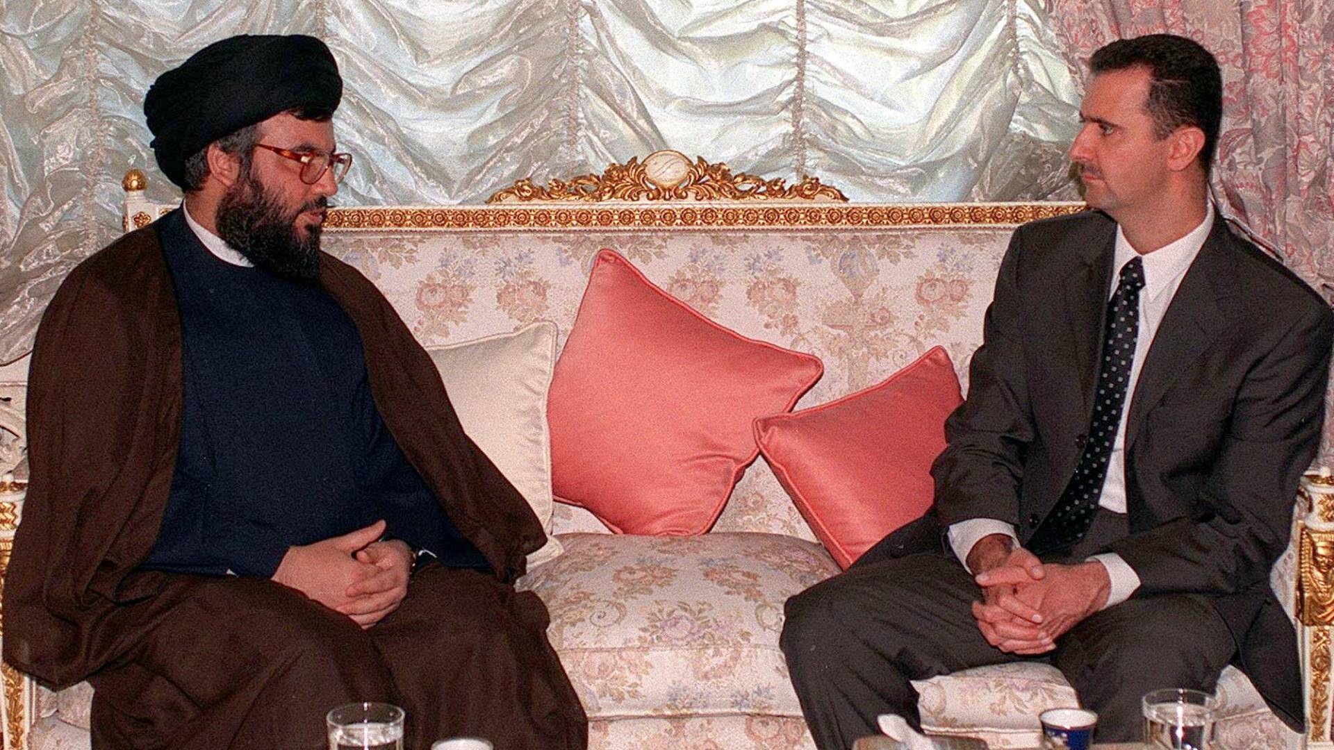 صورة أرشيفية تجمع الرئيس السوري بشار الأسد وأمين عام حزب الله حسن نصرالله