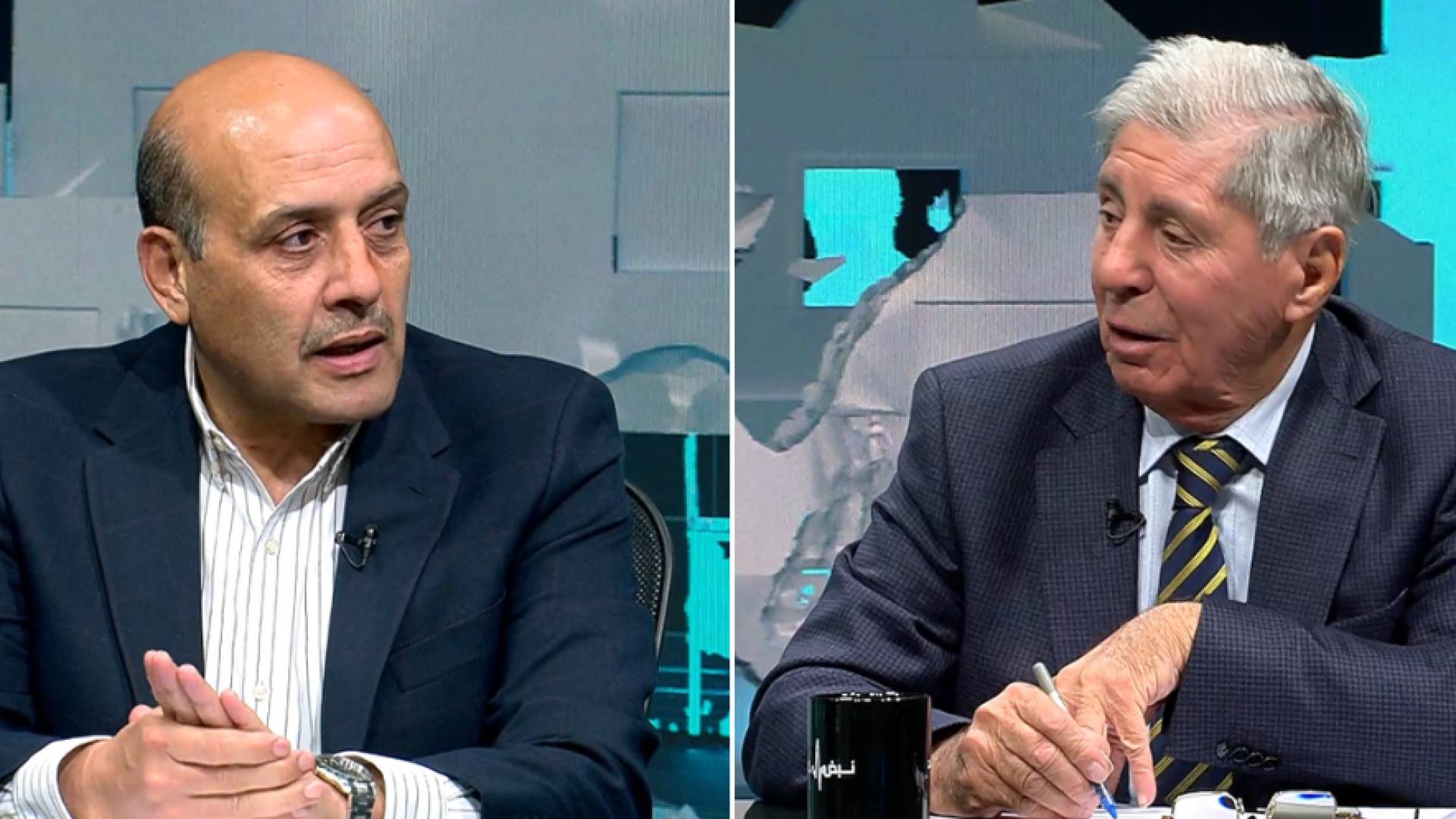 أستاذ العلوم السياسية محمد القطاطشة و المحامي والناشط النقابي سميح خريس