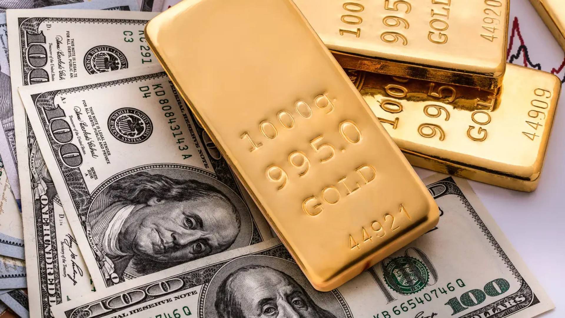 سبائك ذهبية فوق الدولار - تعبيرية