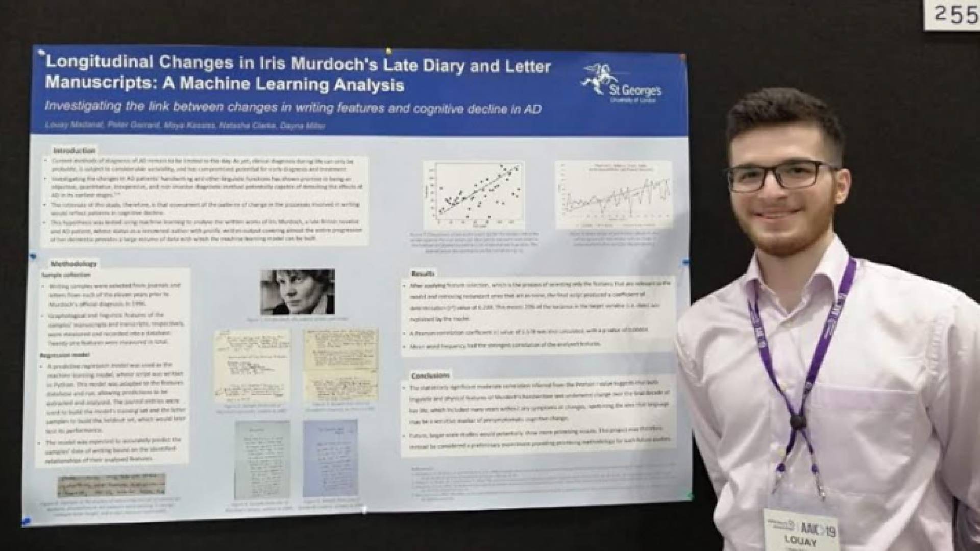 لؤي مدانات أمام ملخص الدراسة التي شارك في تقديمها في مؤتمر لوس أنجليس حول الزهايمر