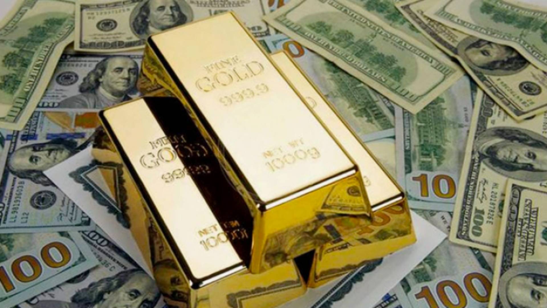 معدن الذهب والدولار الأمريكي - تعبيرية