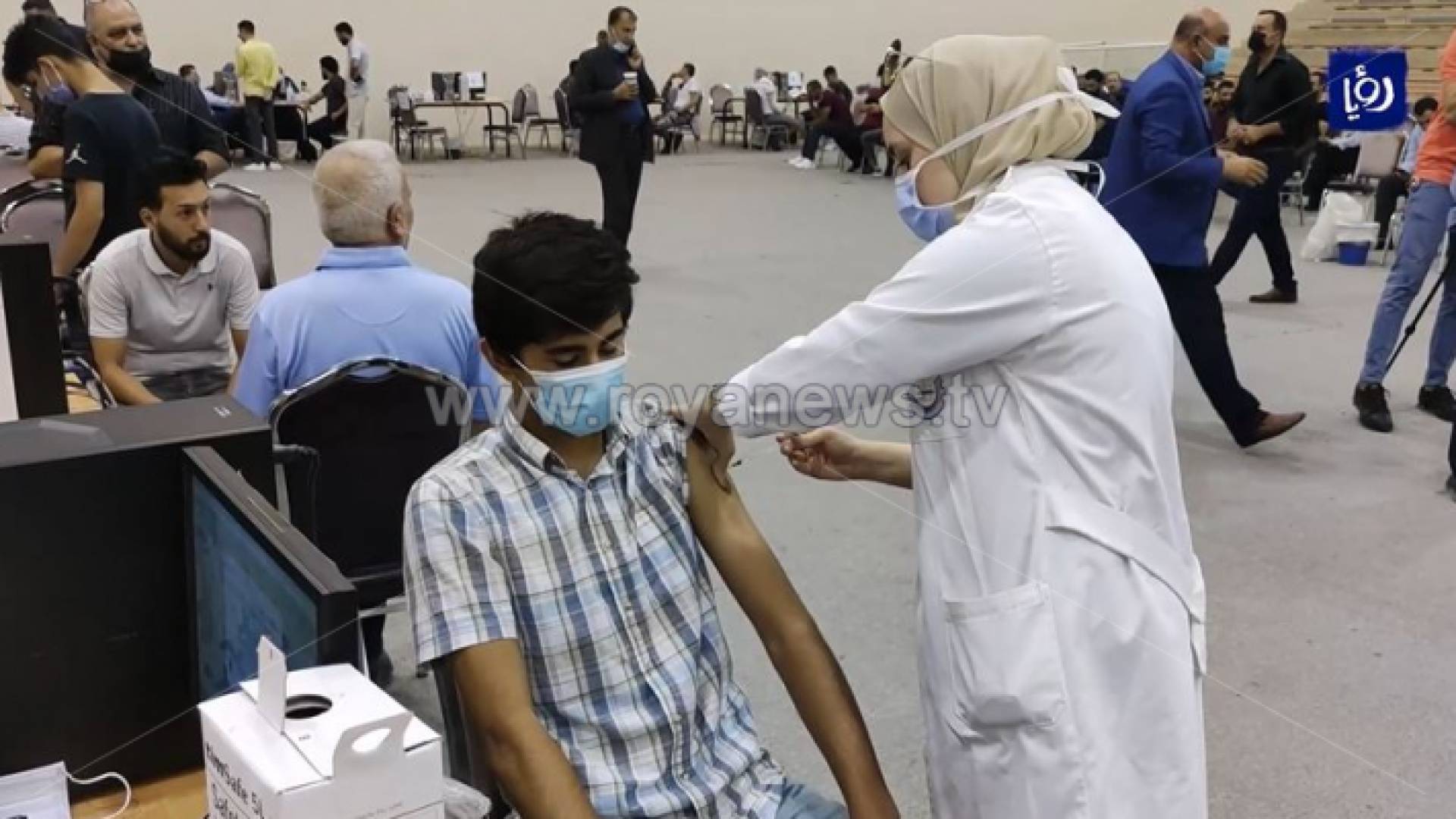 الصورة من احد مراكز التطعيم