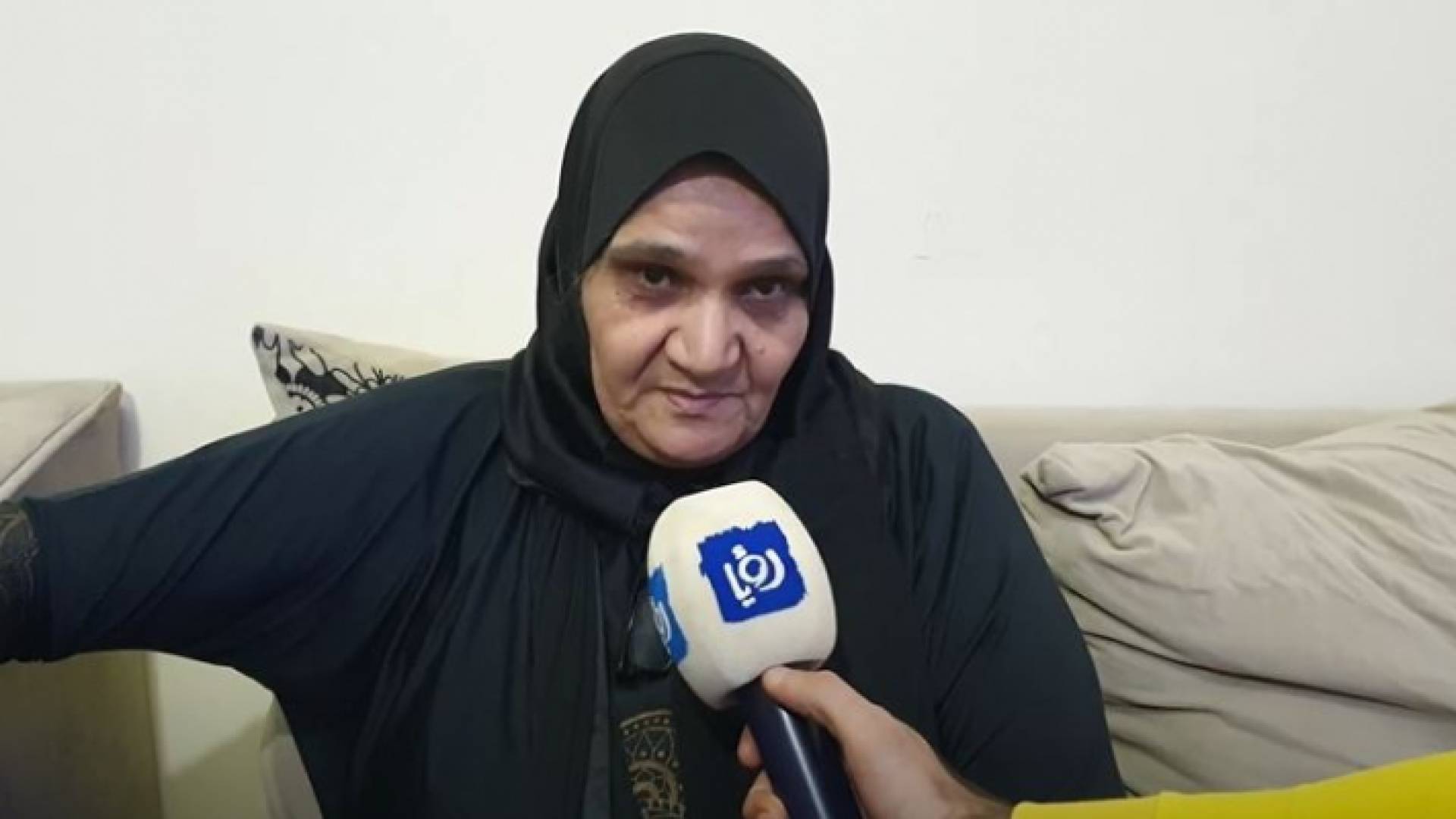 والدة المغدورين الحموري