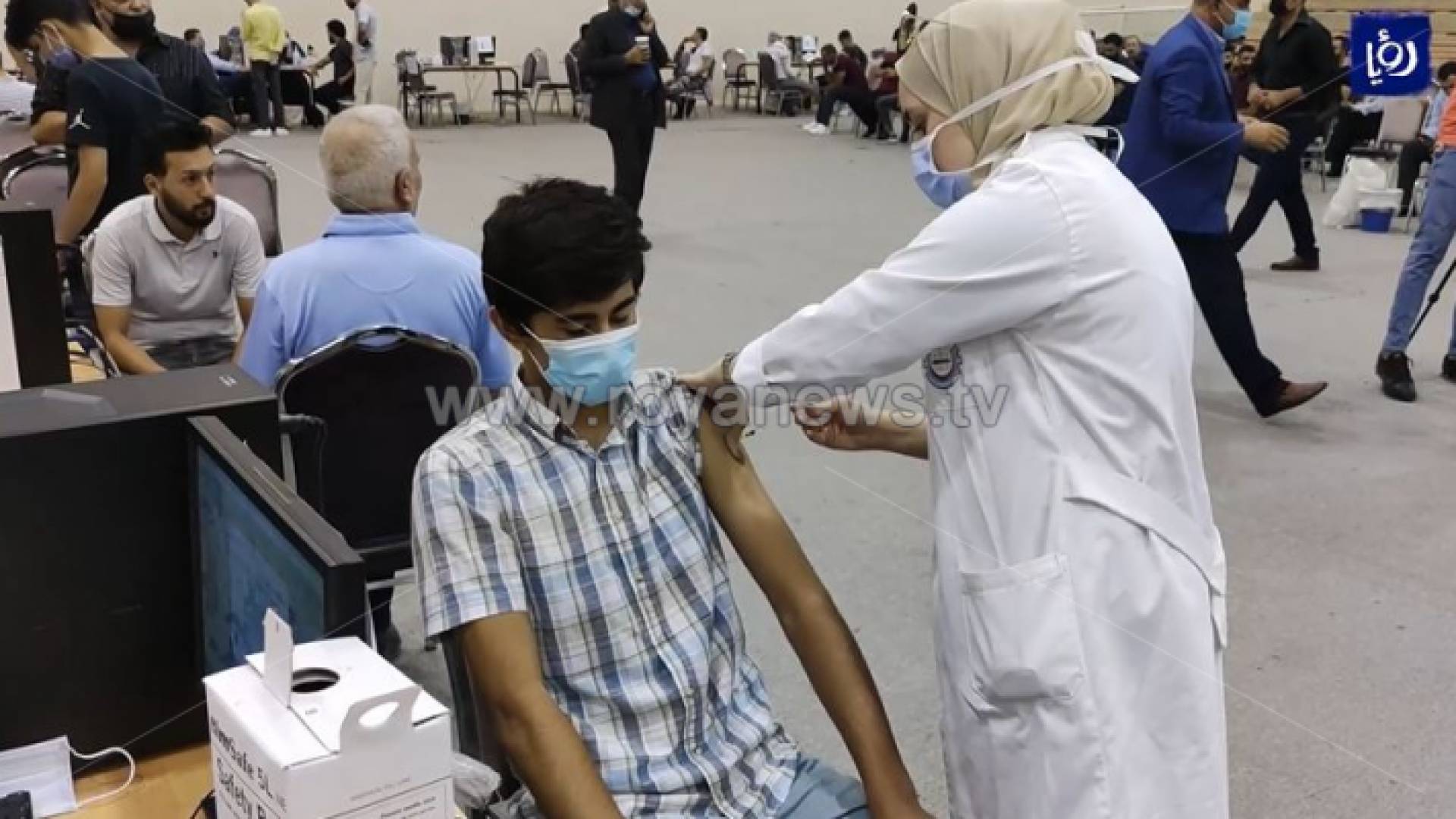 الصورة من احد مراكز التطعيم