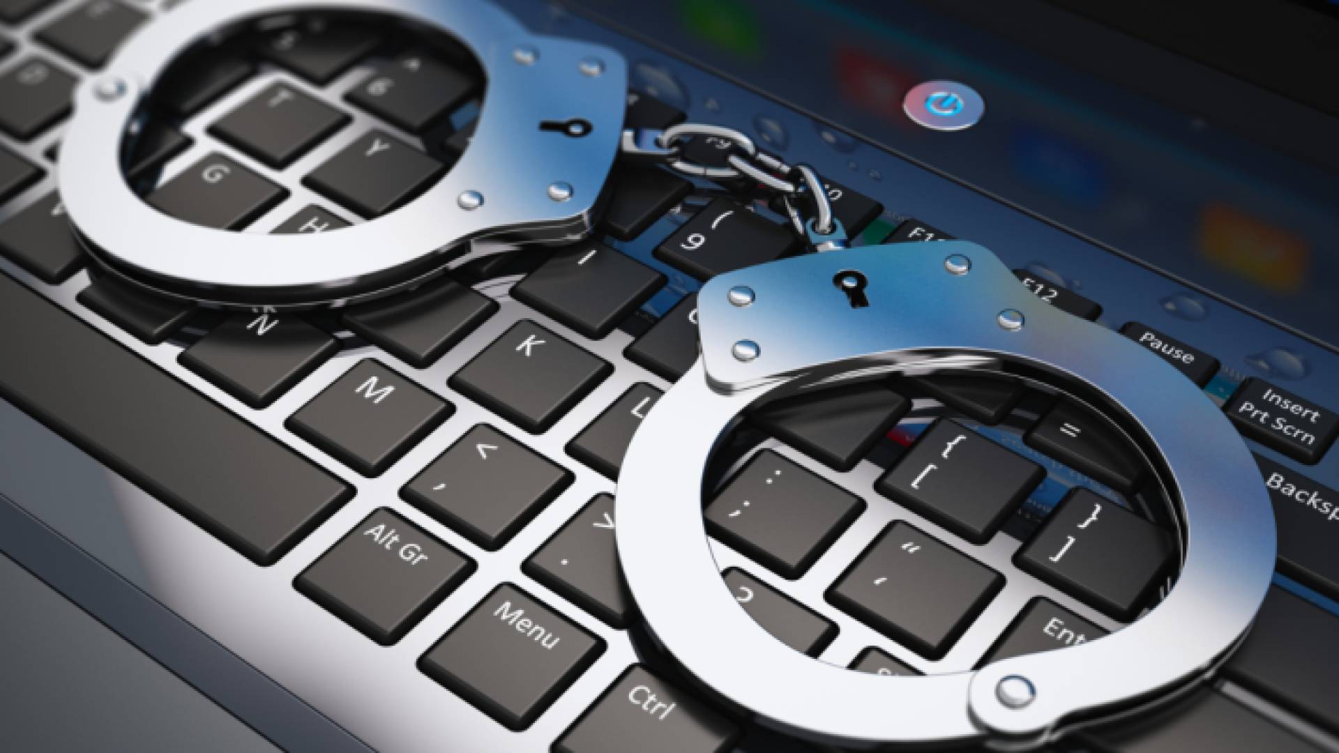 أصفاد وجهاز كمبيوتر "تعبيرية"