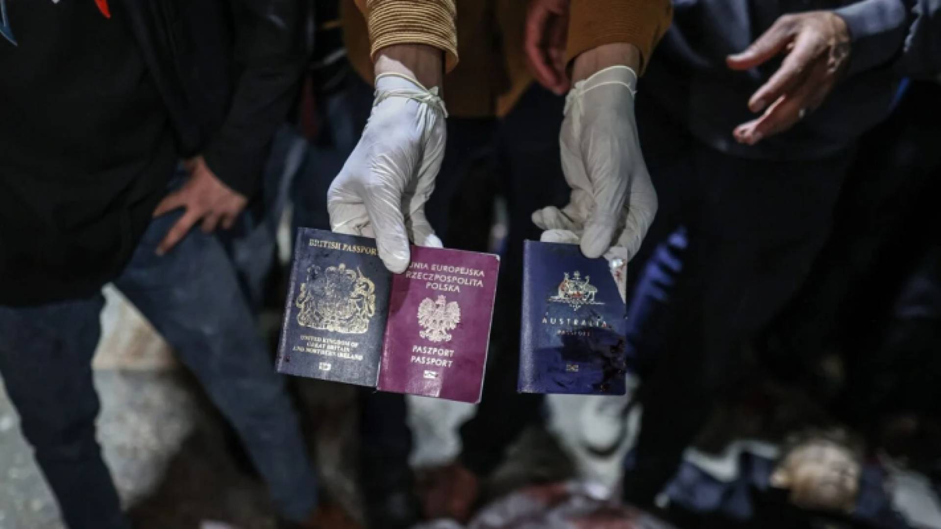 جوازات سفر الفريق الإغاثي بعد استهدافهم من قبل الاحتلال