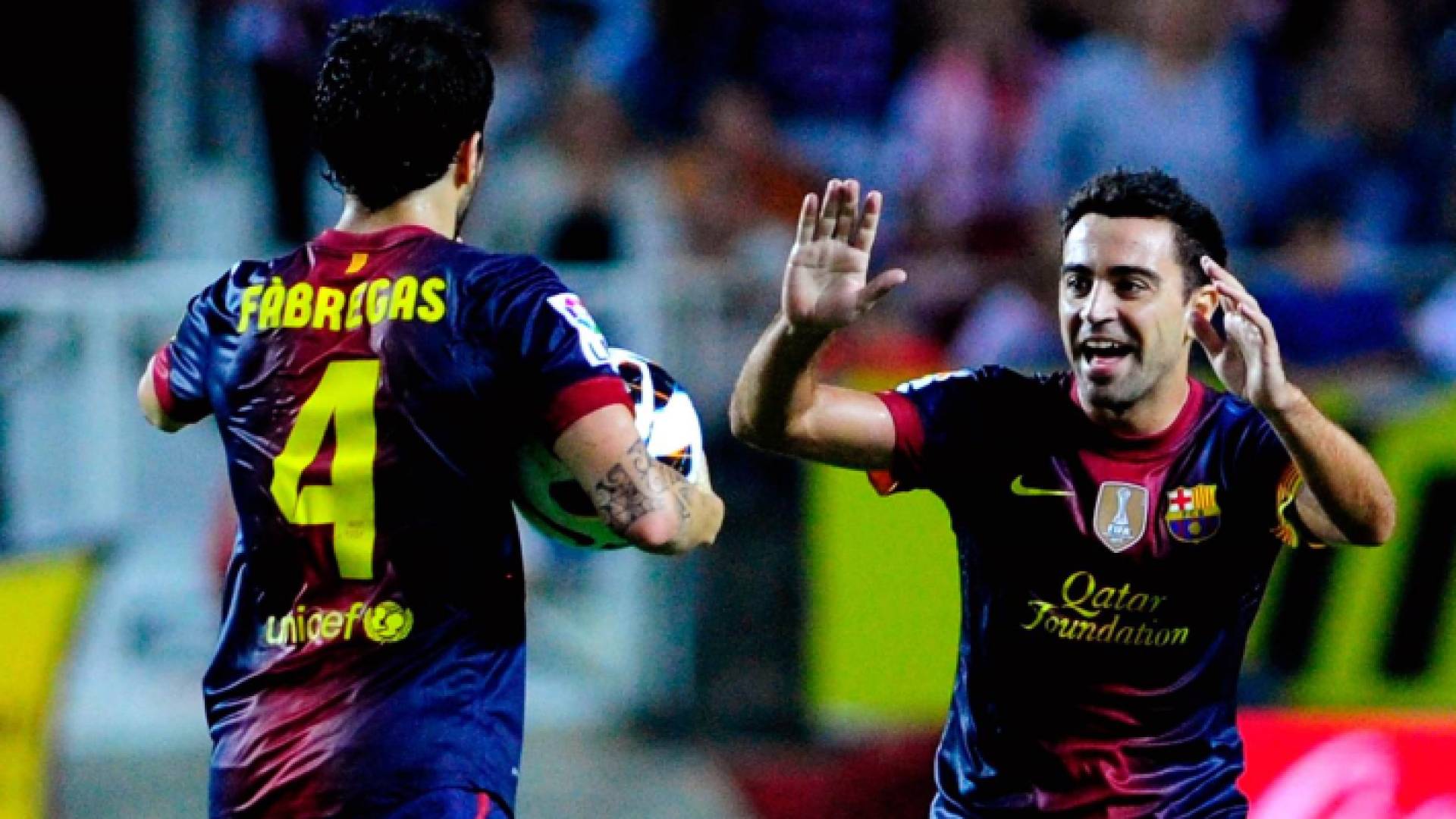 تشافي وفابريغاس من مباراة سابقة لبرشلونة