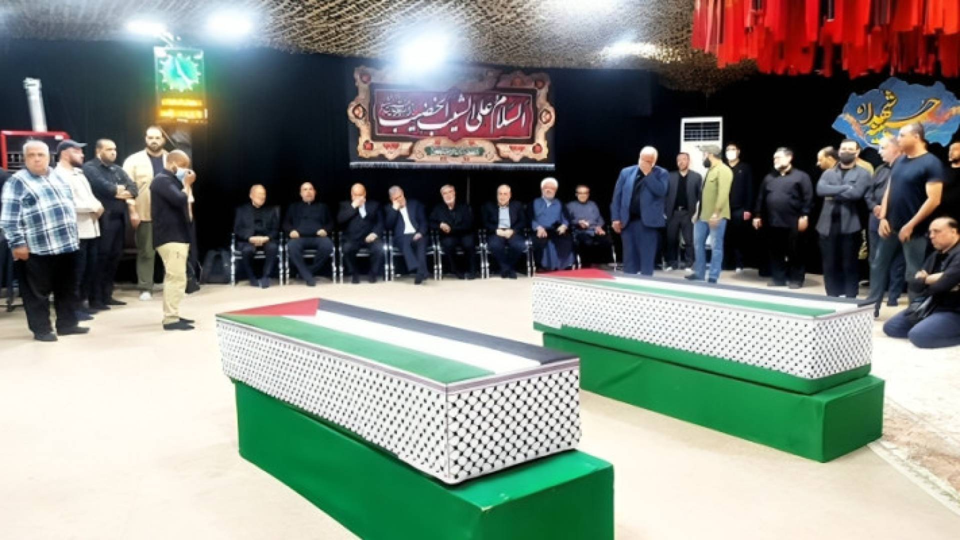 صورة وداع جثمان هنية ومرافقه وسيم أبو شعبان في طهران