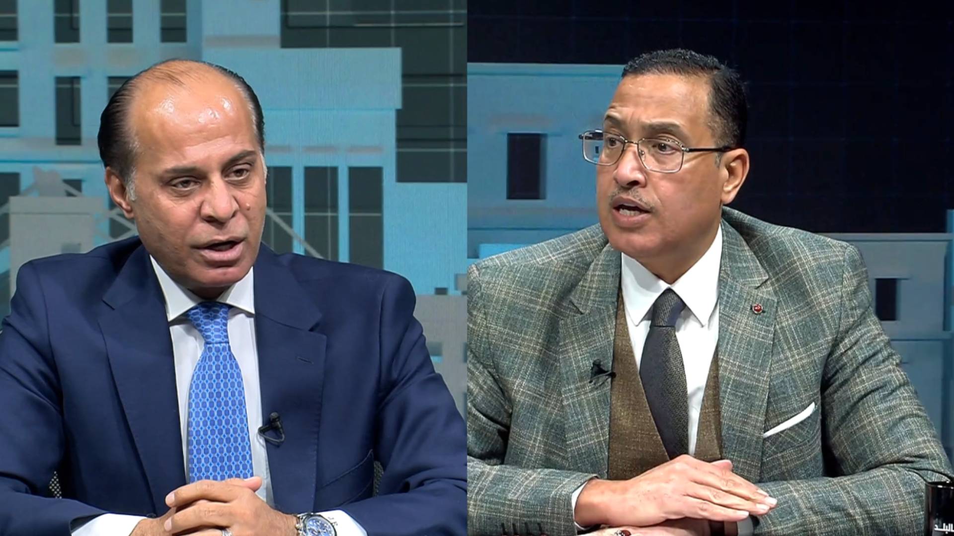 الناشط السياسي جمال رقاد (يسارا)، عضو مجلس النواب خليفة الديات (يمينا)