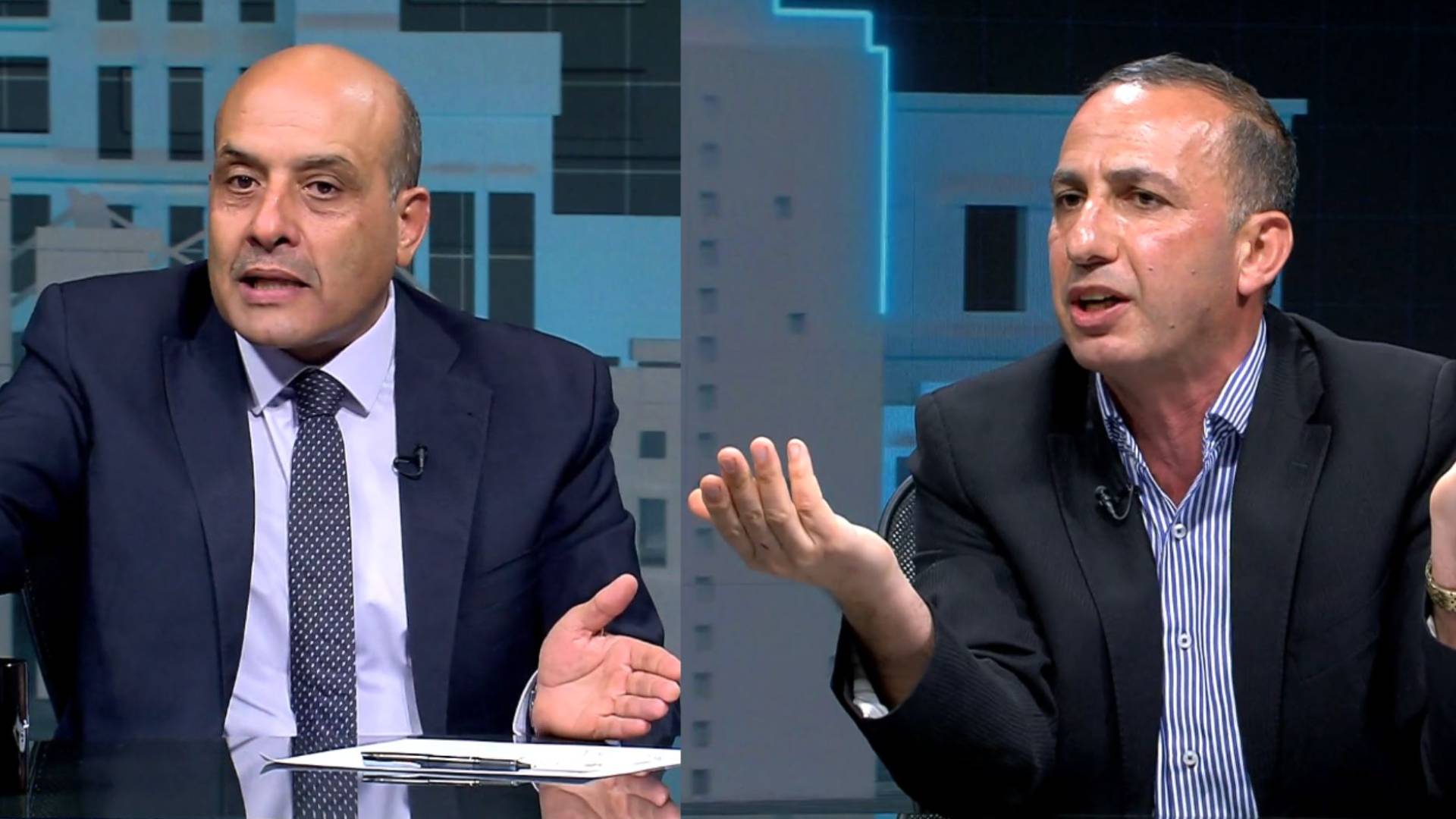 الناشط السياسي شادي مدانات (يمينا) أستاذ العلوم السياسية محمد القطاطشة (يسارا)