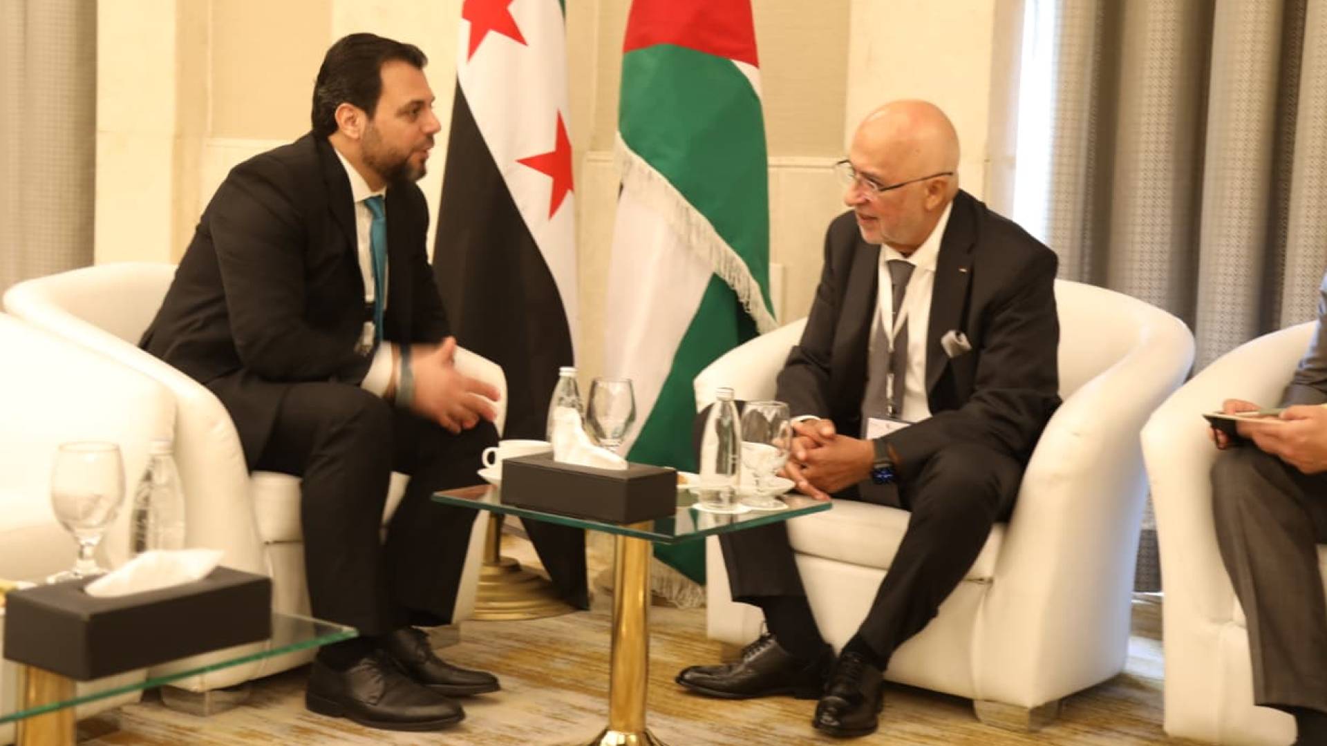 رئيس مجلس مفوضي الهيئة المستقلة للانتخاب موسى المعايطة و رئيس اللجنة العليا لإدارة الانتخابات لمجلس الشعب السوري محمد طه الأحمد